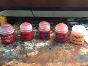 When it comes to red pigments, I have had the best experiences with the GW range, though there are several good ones out there